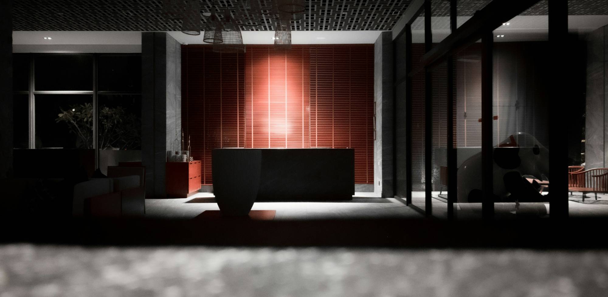 Boutique hotel reception desk at night representing around-the-clock remote operations